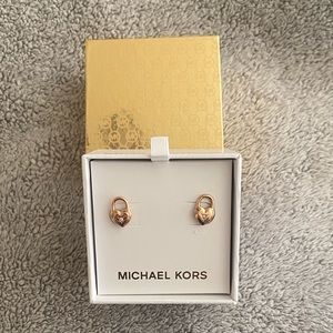 Michael Kors heart lock earrings.